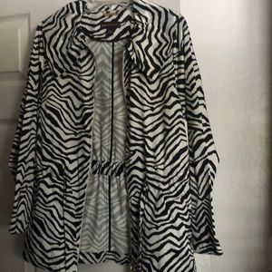 Dana Buchman jacket in zebra print. Ties around waist with dual zippers.